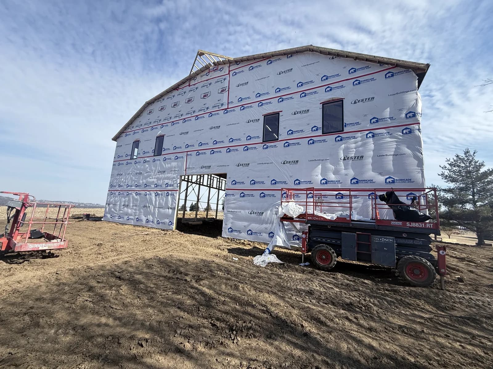 Post-frame building wrapped before siding by ORC in Johnson County