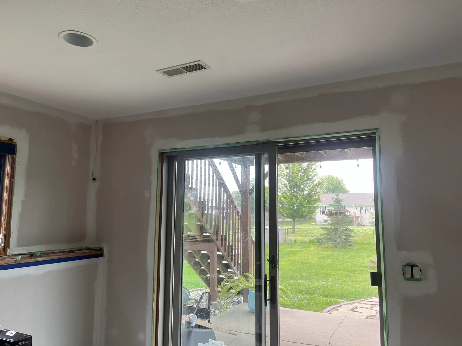 Interior renovation with new patio door and finished walls by ORC in Davenport
