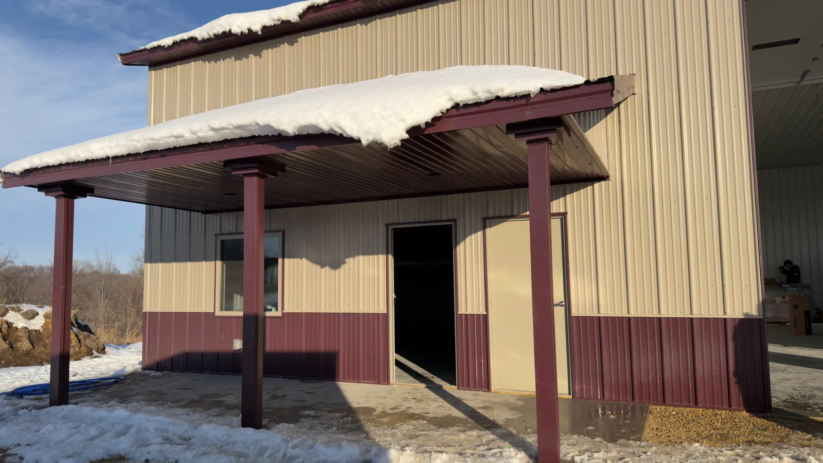 Metal siding and covered porch by ORC in Iowa City