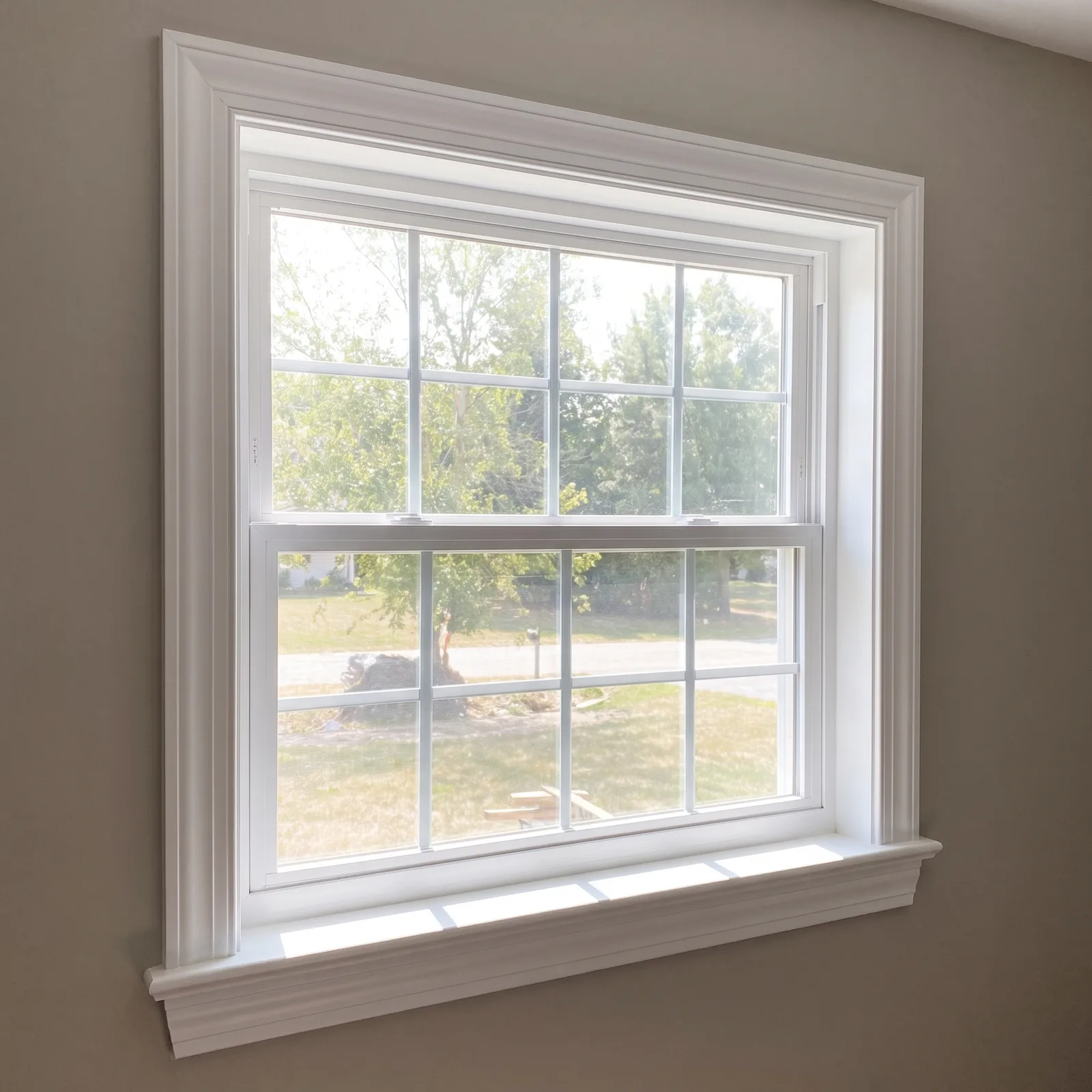 Finished new window with interior trim by ORC in Dubuque
